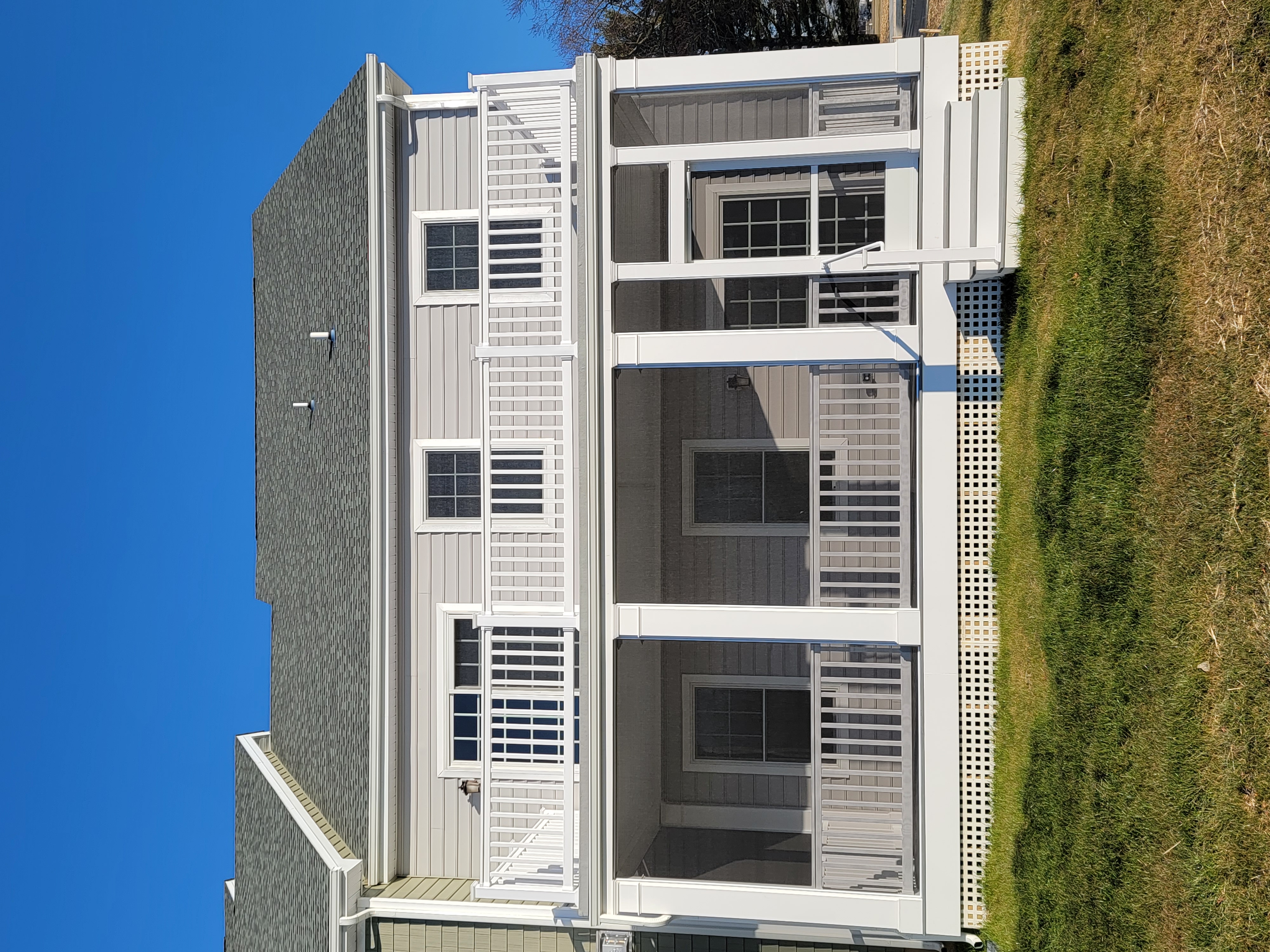 Double front porch with railings and columns