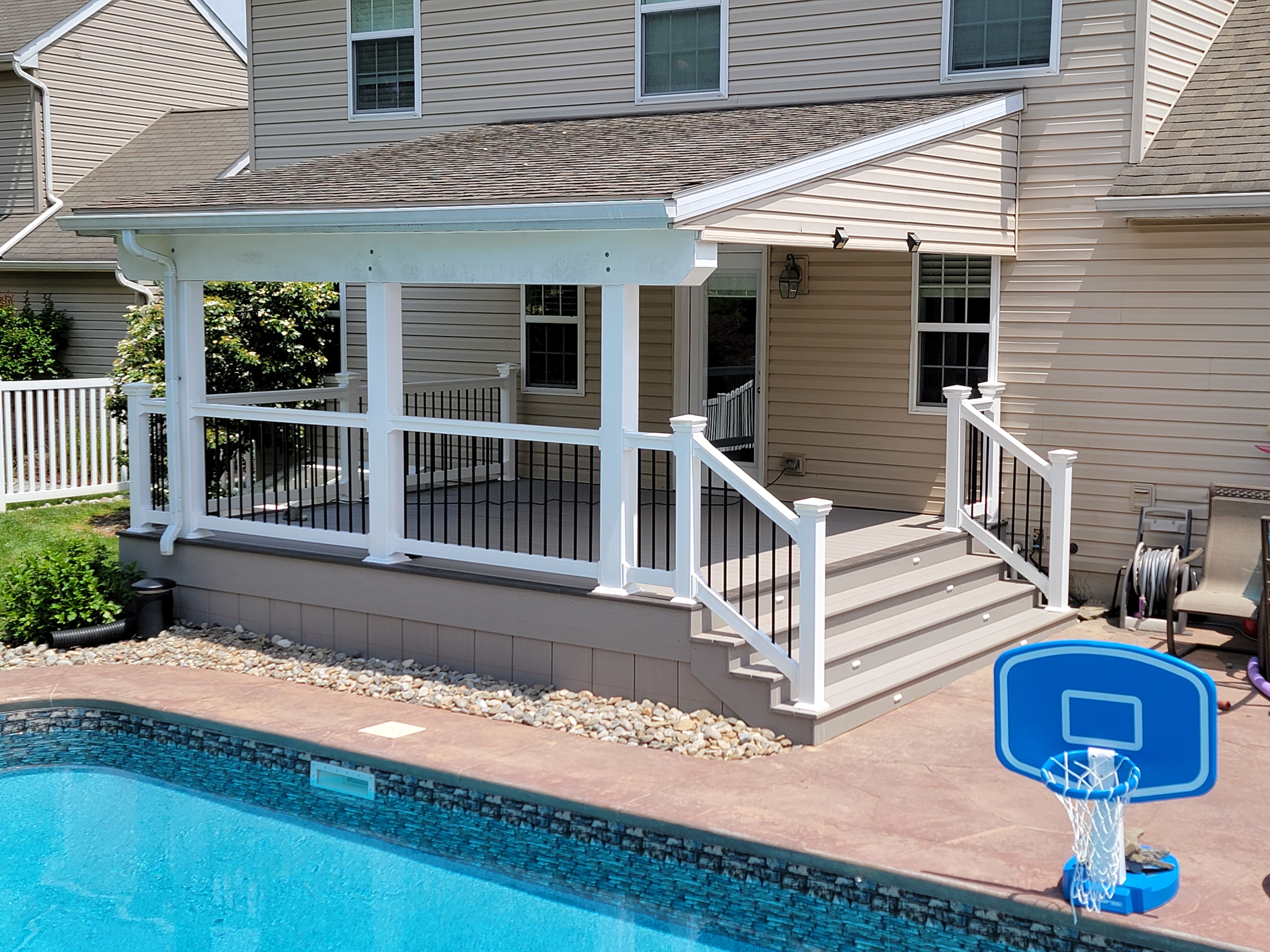 Poolside porch with steps and railing
