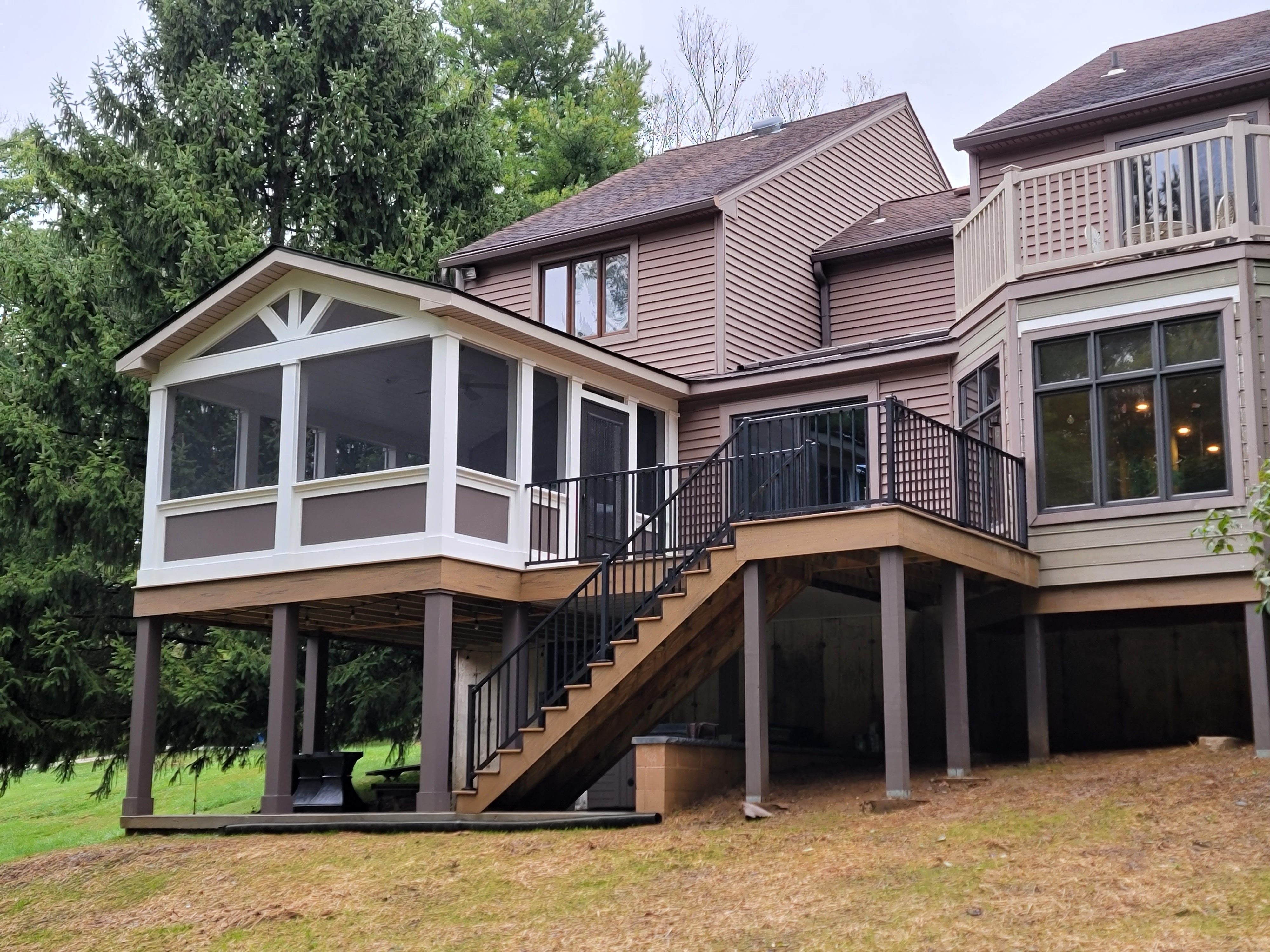 Elevated deck with screened porch and stairs