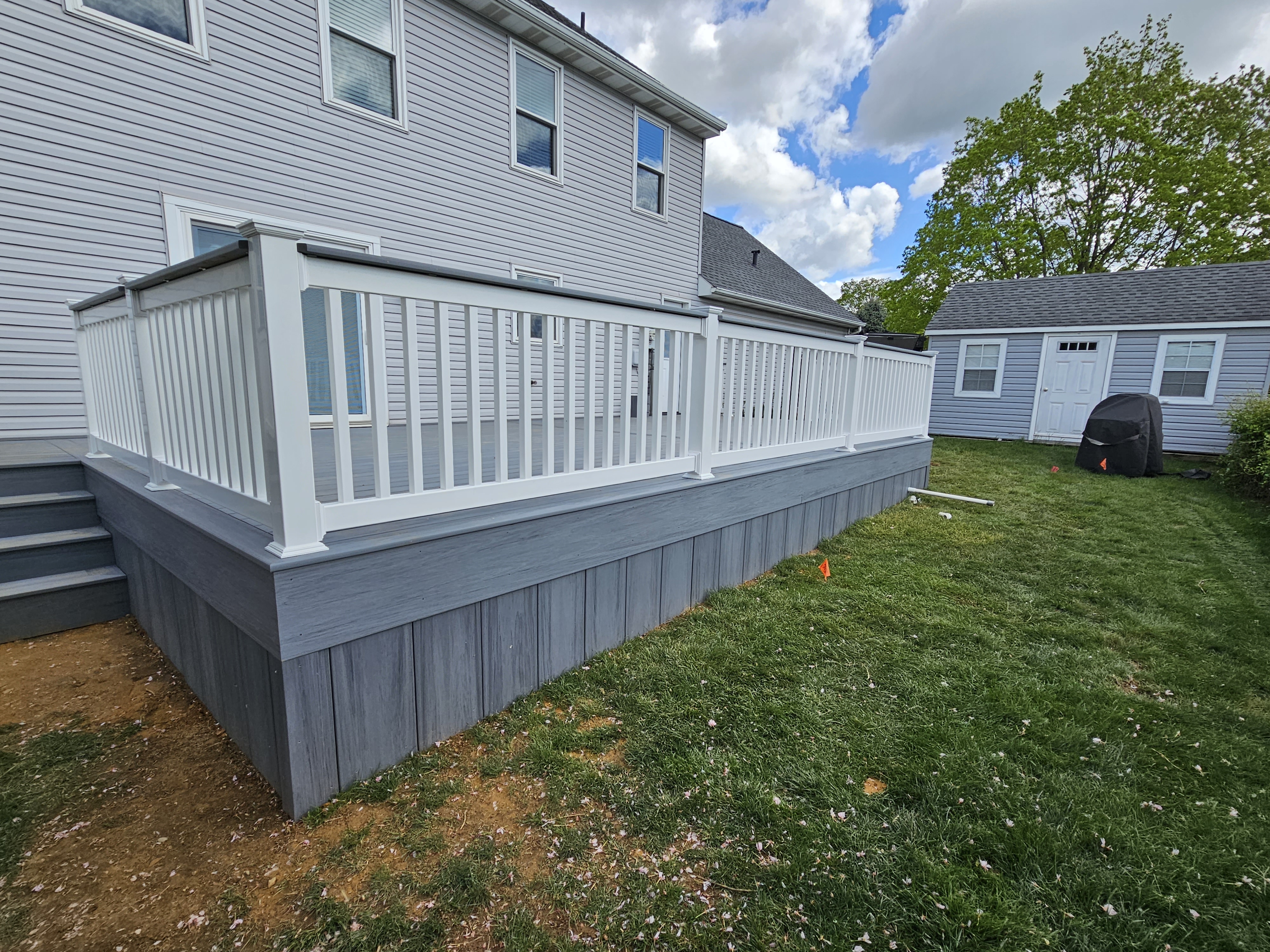 Vinyl deck with skirting and railing
