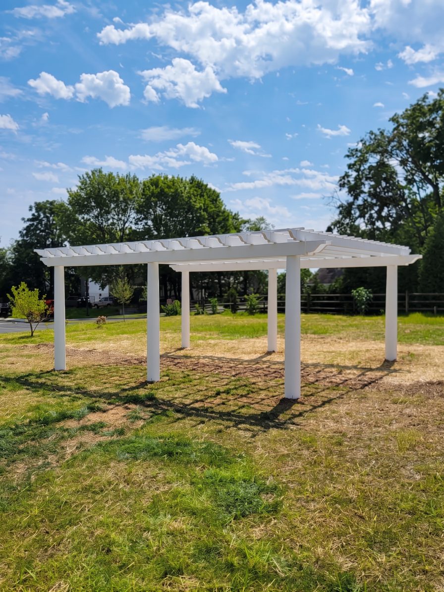 Custom pergola creating shade over an outdoor living area