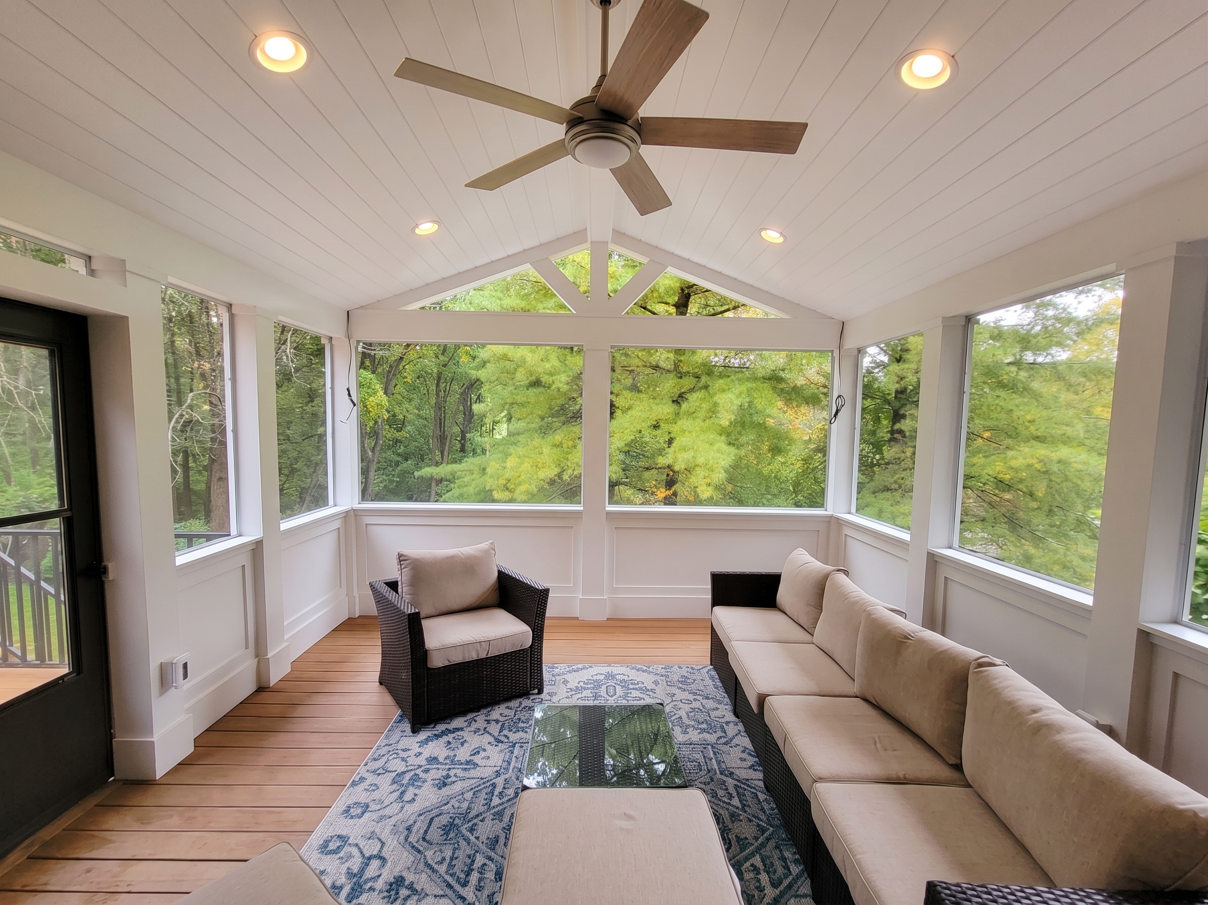Bright three-season room connected to a home